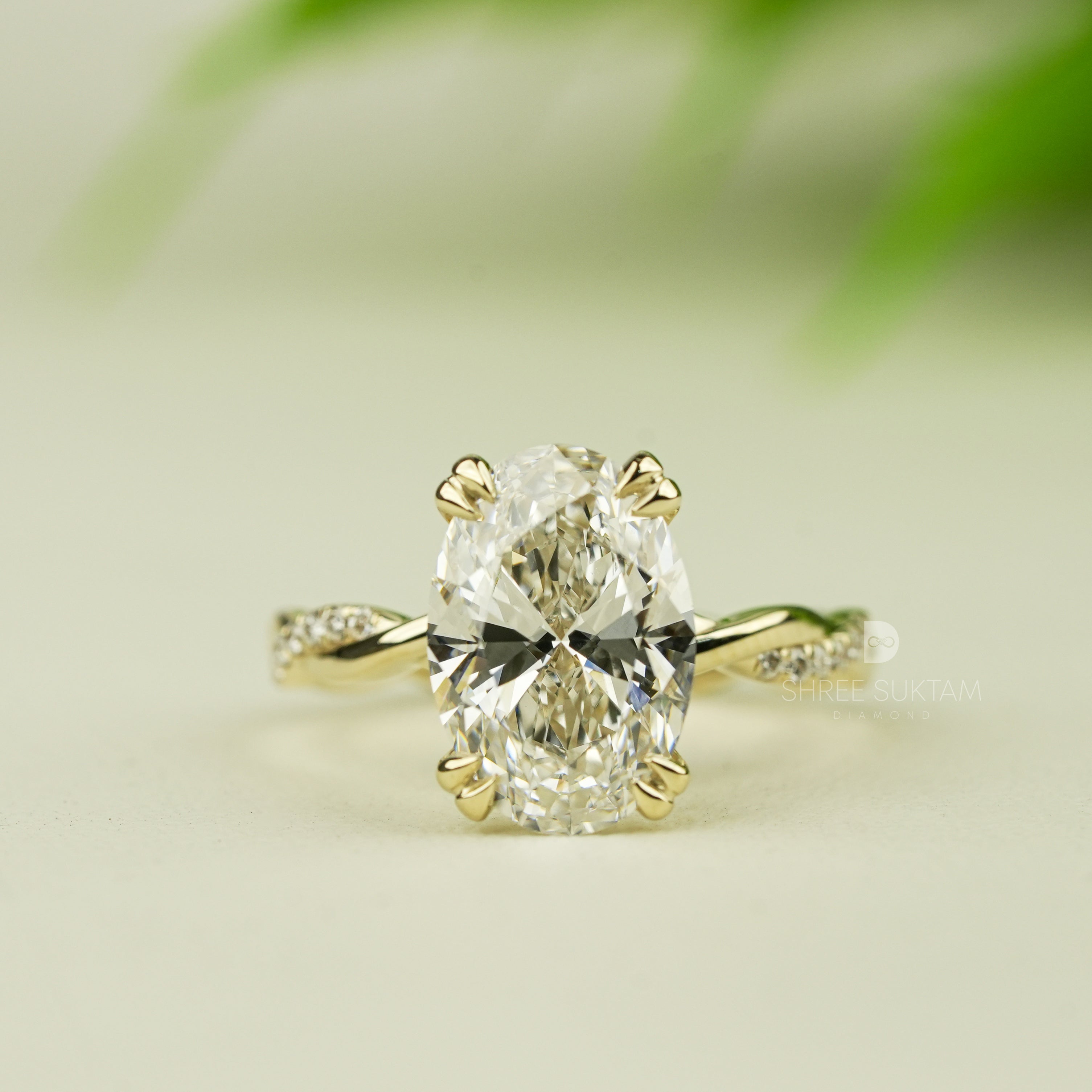 Stunning oval-cut diamond engagement ring set in yellow gold with intricate twisted band design. The solitaire diamond is securely held by four elegant prongs, reflecting brilliance and fire. A delicate and romantic piece of fine jewelry, perfect for engagements, proposals, anniversaries, or special occasions. A handcrafted timeless ring that radiates luxury, charm, and sophistication for the modern bride-to-be moissanite watch