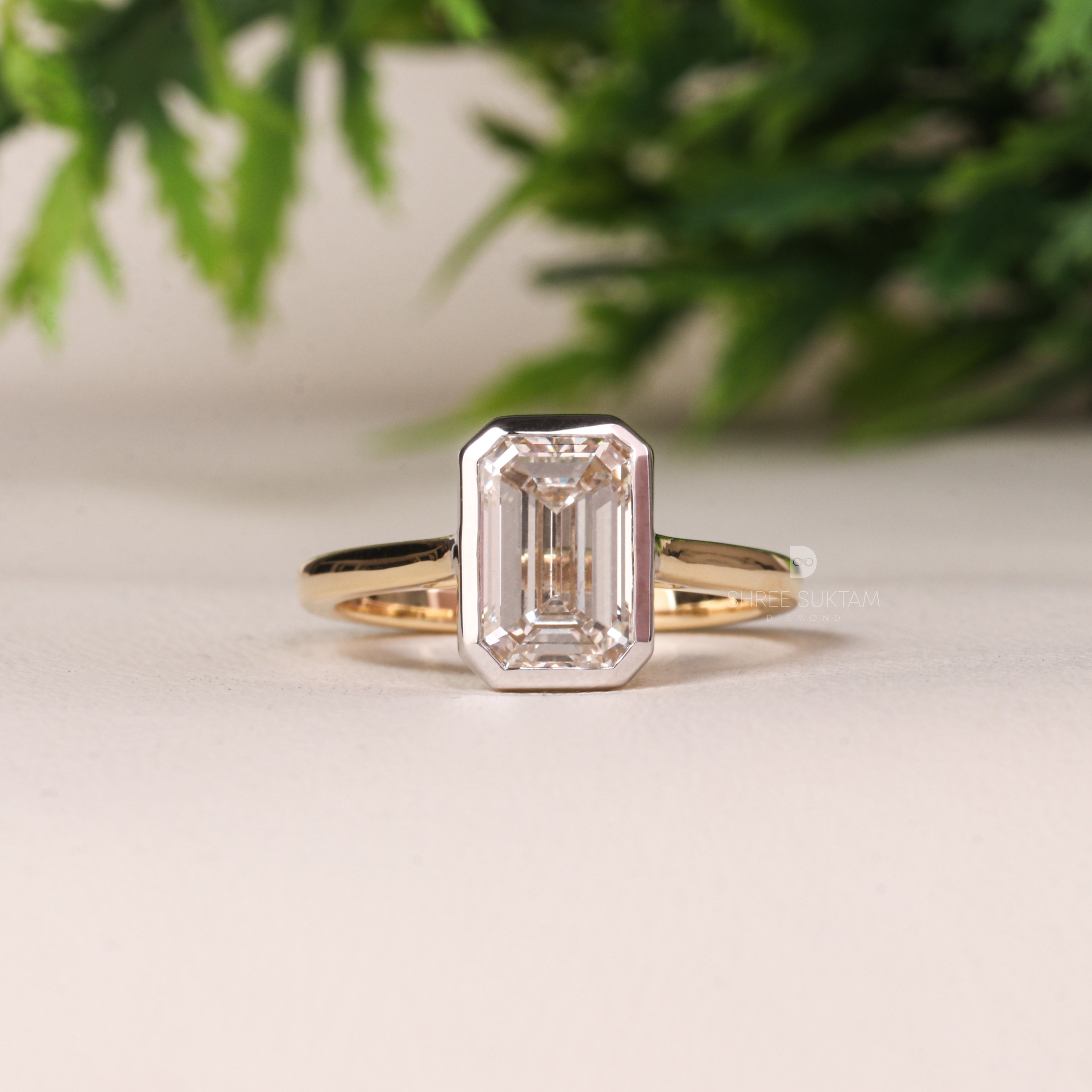 emerald cut diamond ring, bezel set engagement ring, yellow gold diamond ring, minimalist diamond ring, solitaire engagement ring, emerald cut solitaire ring, modern bridal jewelry, classic gold ring, dainty diamond ring, handmade engagement ring, fine gold jewelry, custom diamond ring, timeless engagement ring, wedding ring for women, luxury diamond ring, ethical gold ring, emerald ring for proposal, gift for her