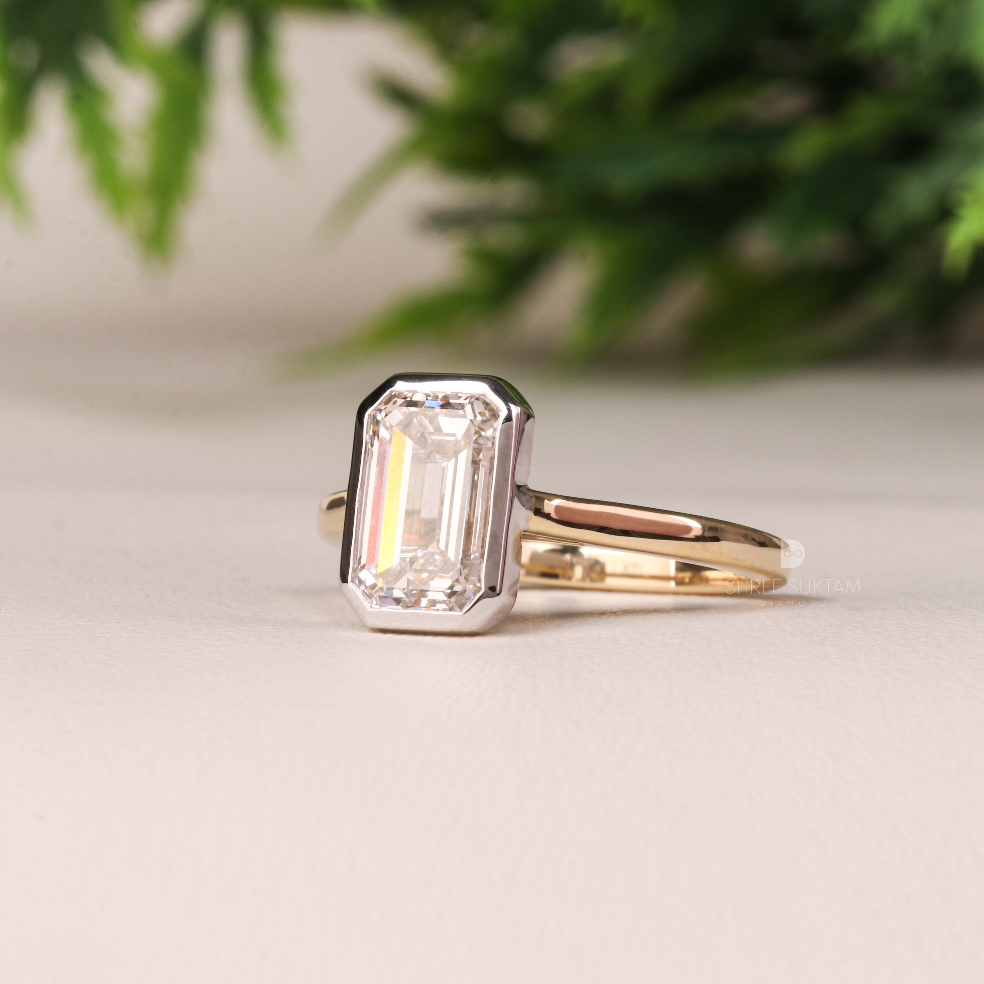 emerald cut diamond ring, bezel set engagement ring, yellow gold diamond ring, minimalist diamond ring, solitaire engagement ring, emerald cut solitaire ring, modern bridal jewelry, classic gold ring, dainty diamond ring, handmade engagement ring, fine gold jewelry, custom diamond ring, timeless engagement ring, wedding ring for women, luxury diamond ring, ethical gold ring, emerald ring for proposal, gift for her Western Ring 