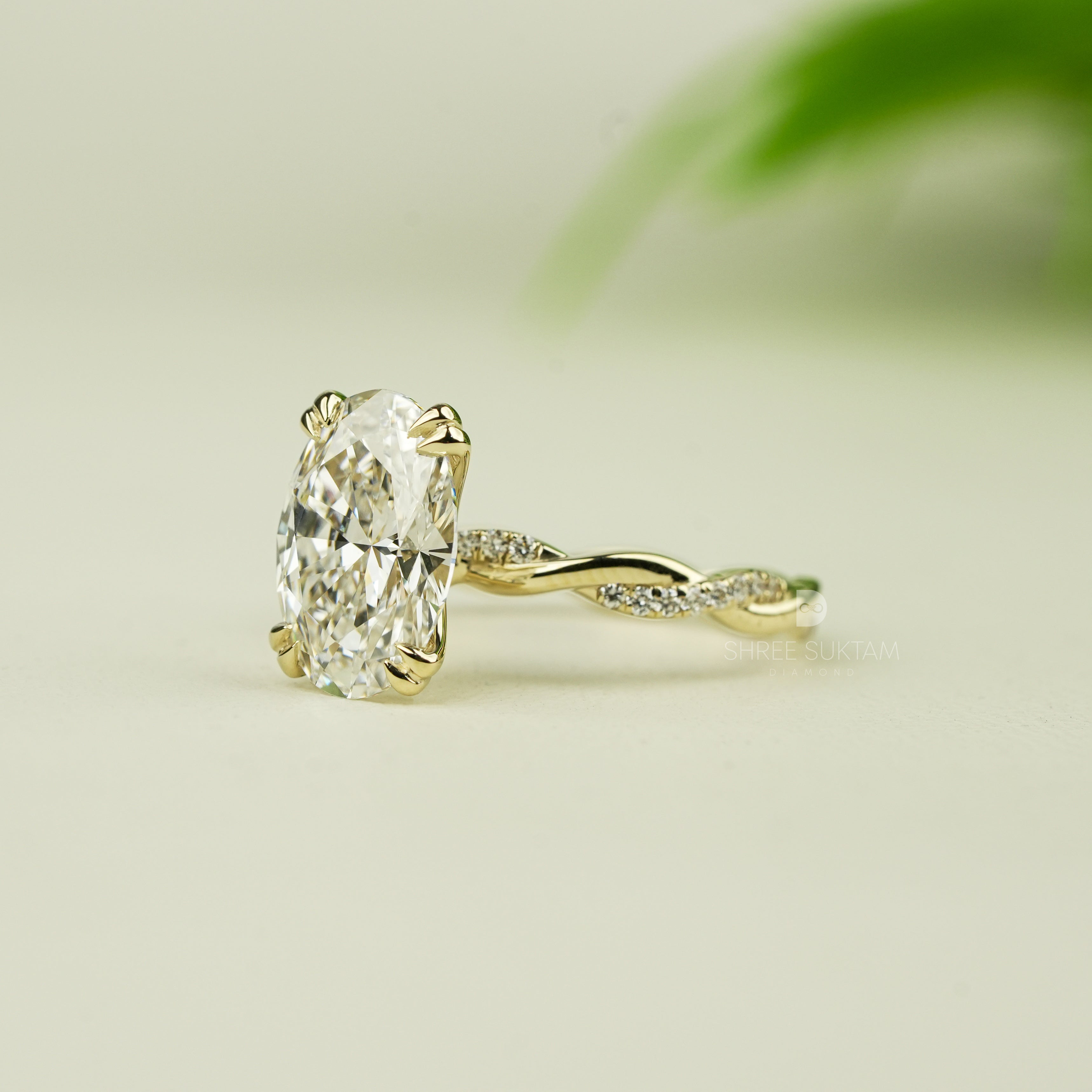 Stunning oval-cut diamond engagement ring set in yellow gold with intricate twisted band design. The solitaire diamond is securely held by four elegant prongs, reflecting brilliance and fire. A delicate and romantic piece of fine jewelry, perfect for engagements, proposals, anniversaries, or special occasions. A handcrafted timeless ring that radiates luxury, charm, and sophistication for the modern bride-to-be moissanite watch