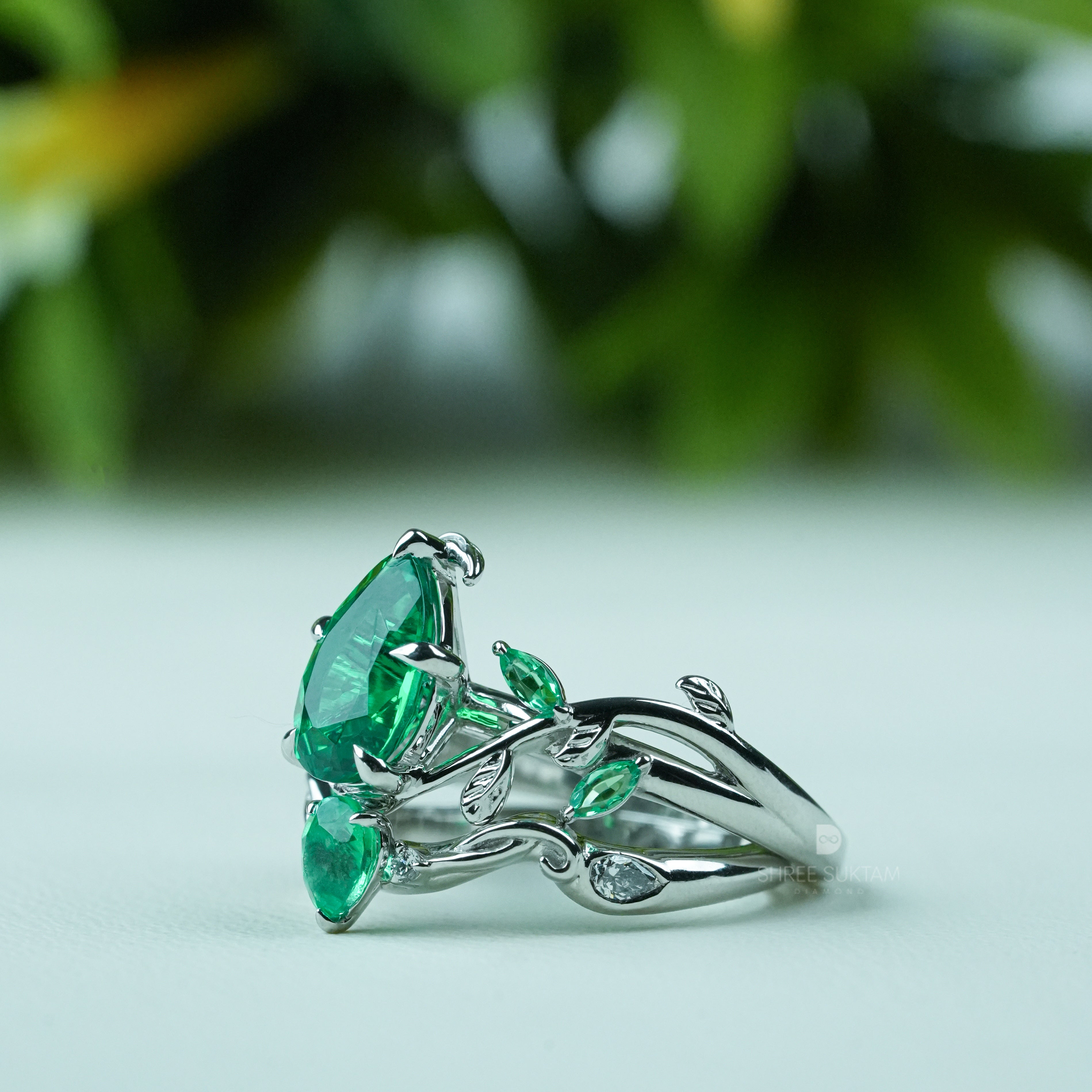 Emerald engagement ring, nature inspired ring, vine leaf ring, silver emerald jewelry, green gemstone ring, pear cut emerald ring, statement emerald ring, vintage style emerald ring, botanical jewelry, leaf design ring, gemstone promise ring, emerald wedding ring, nature lover jewelry, unique emerald ring, silver gemstone ring, anniversary gift ring, handmade emerald jewelry, bridal emerald ring, boho emerald ring, luxury gemstone jewelry.