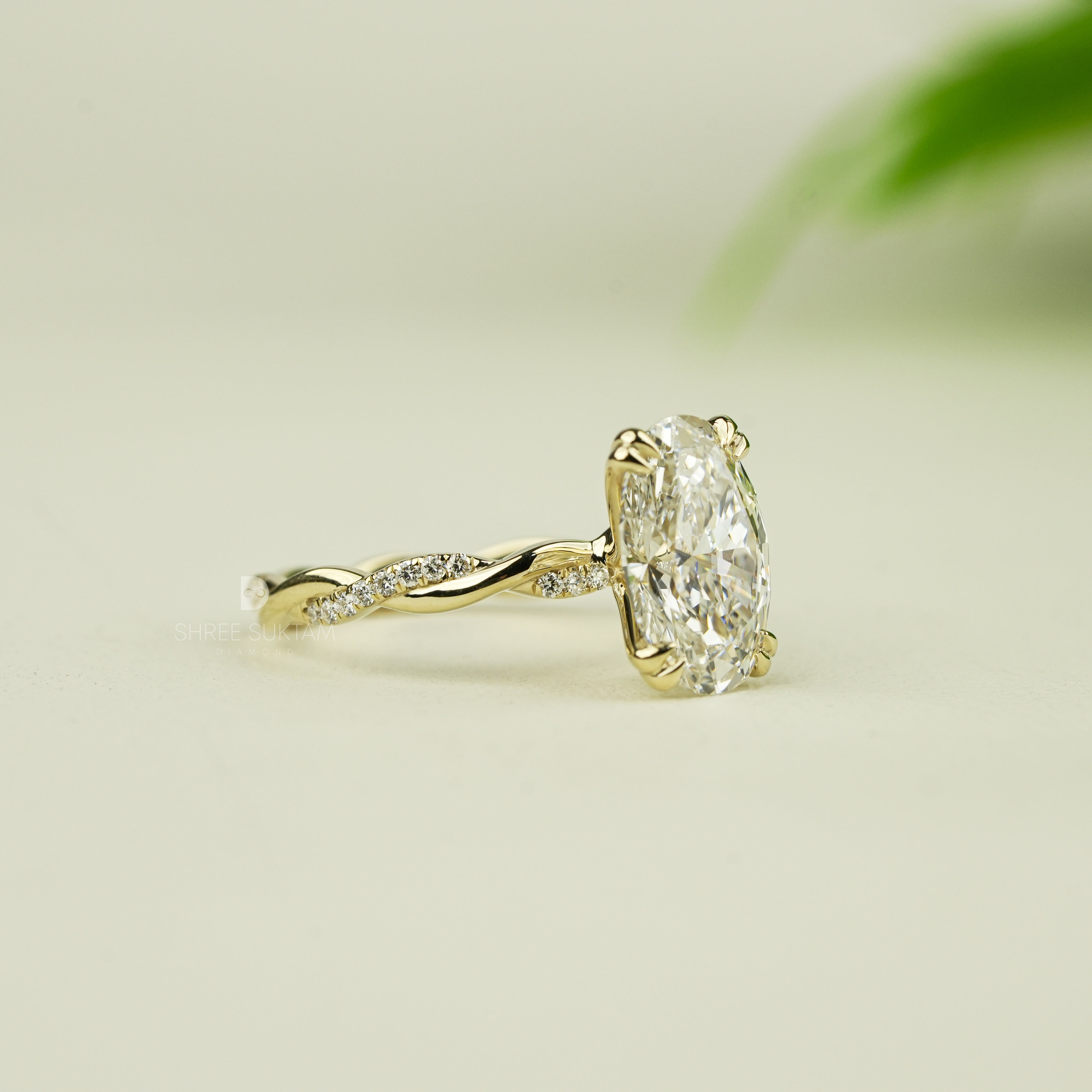 Stunning oval-cut diamond engagement ring set in yellow gold with intricate twisted band design. The solitaire diamond is securely held by four elegant prongs, reflecting brilliance and fire. A delicate and romantic piece of fine jewelry, perfect for engagements, proposals, anniversaries, or special occasions. A handcrafted timeless ring that radiates luxury, charm, and sophistication for the modern bride-to-be moissanite watch