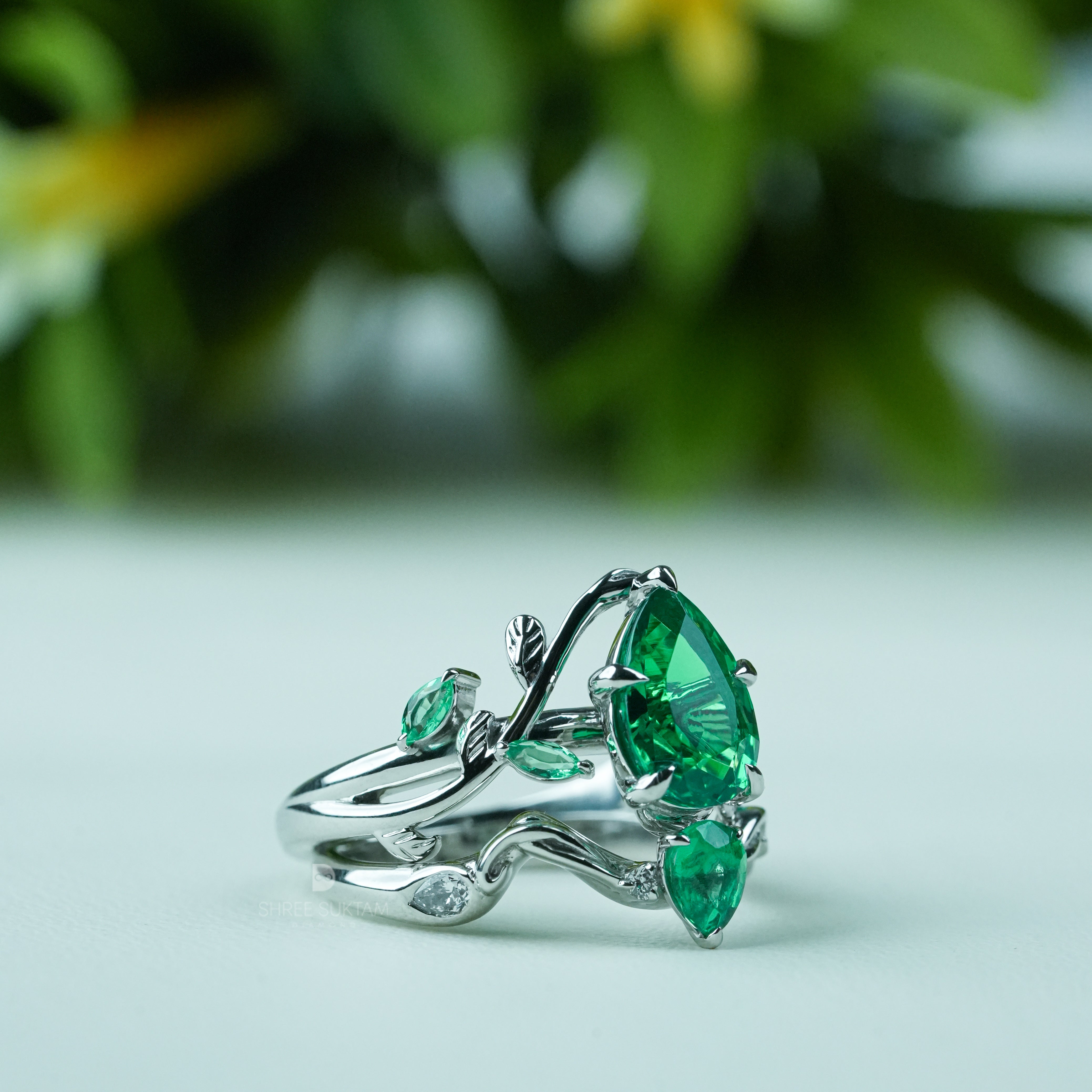 Emerald engagement ring, nature inspired ring, vine leaf ring, silver emerald jewelry, green gemstone ring, pear cut emerald ring, statement emerald ring, vintage style emerald ring, botanical jewelry, leaf design ring, gemstone promise ring, emerald wedding ring, nature lover jewelry, unique emerald ring, silver gemstone ring, anniversary gift ring, handmade emerald jewelry, bridal emerald ring, boho emerald ring, luxury gemstone jewelry.