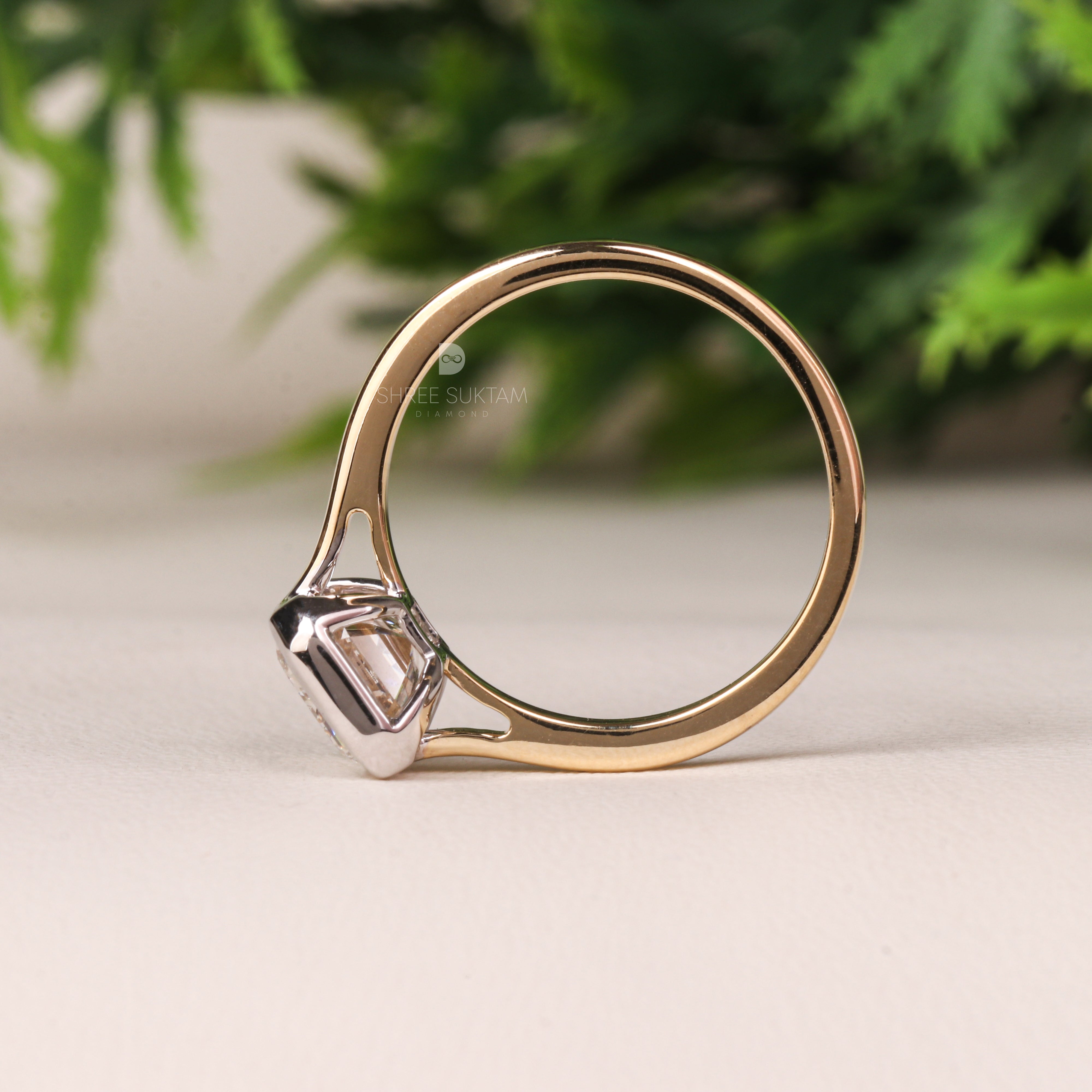 emerald cut diamond ring, bezel set engagement ring, yellow gold diamond ring, minimalist diamond ring, solitaire engagement ring, emerald cut solitaire ring, modern bridal jewelry, classic gold ring, dainty diamond ring, handmade engagement ring, fine gold jewelry, custom diamond ring, timeless engagement ring, wedding ring for women, luxury diamond ring, ethical gold ring, emerald ring for proposal, gift for her Western Ring 