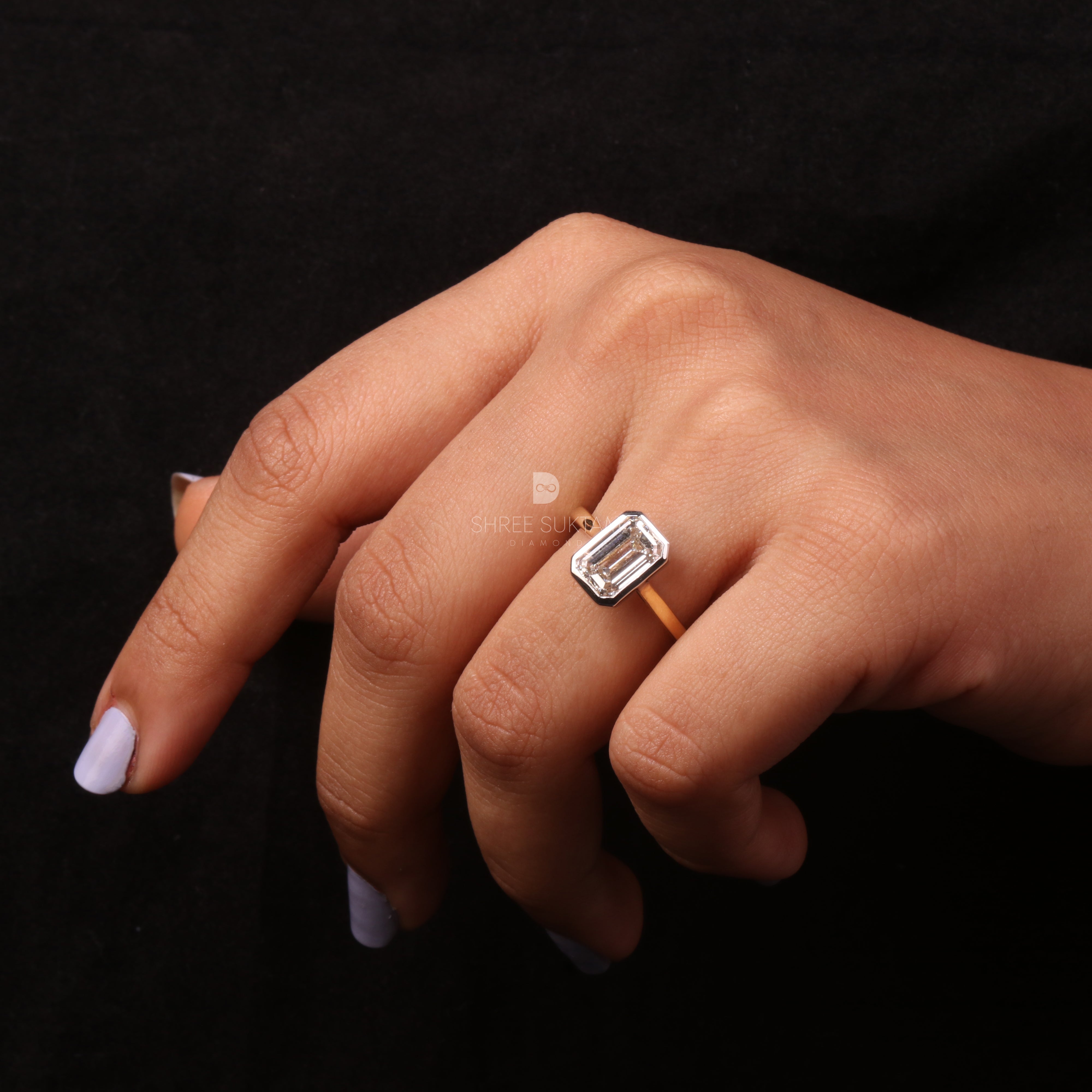 emerald cut diamond ring, bezel set engagement ring, yellow gold diamond ring, minimalist diamond ring, solitaire engagement ring, emerald cut solitaire ring, modern bridal jewelry, classic gold ring, dainty diamond ring, handmade engagement ring, fine gold jewelry, custom diamond ring, timeless engagement ring, wedding ring for women, luxury diamond ring, ethical gold ring, emerald ring for proposal, gift for her Western Ring 