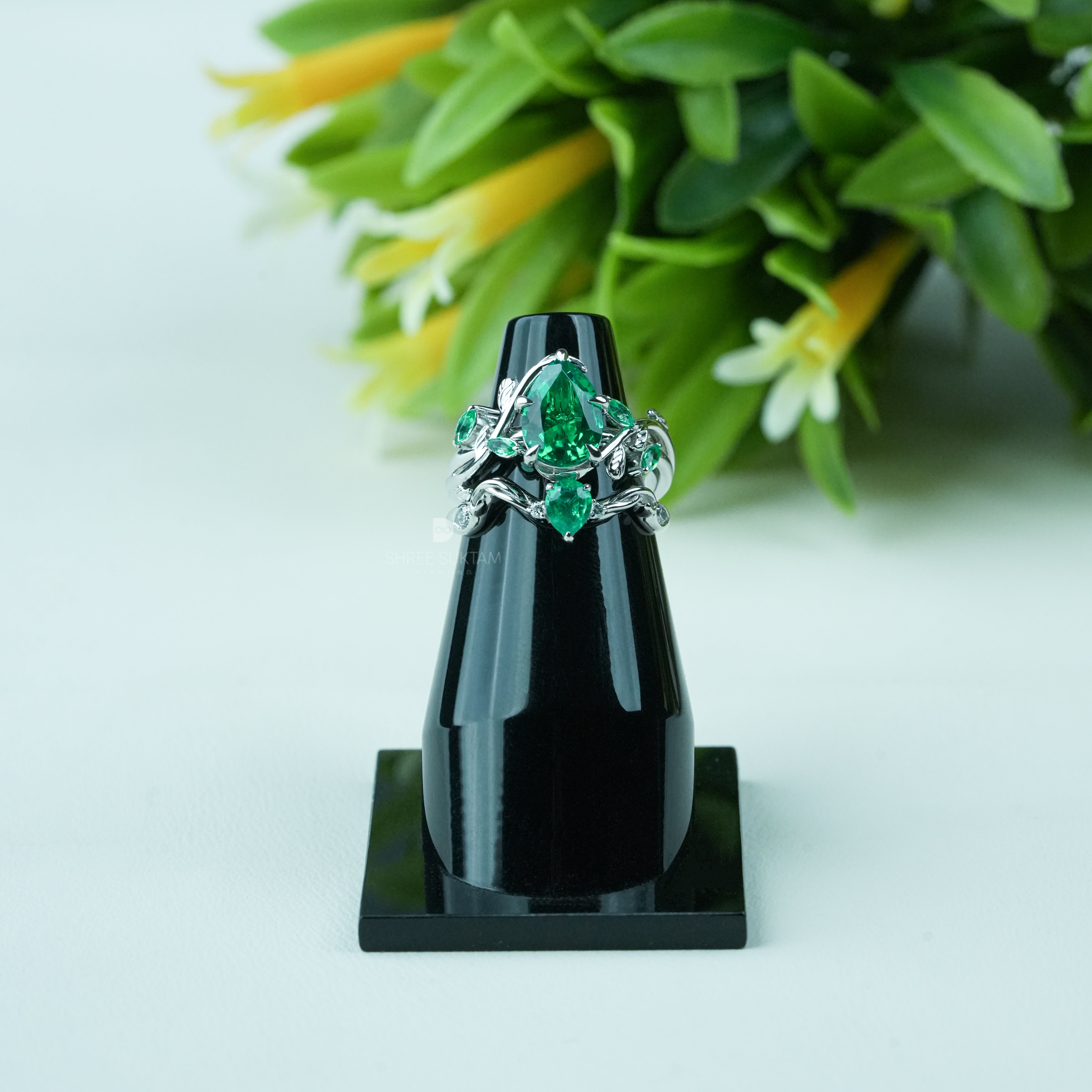 Emerald engagement ring, nature inspired ring, vine leaf ring, silver emerald jewelry, green gemstone ring, pear cut emerald ring, statement emerald ring, vintage style emerald ring, botanical jewelry, leaf design ring, gemstone promise ring, emerald wedding ring, nature lover jewelry, unique emerald ring, silver gemstone ring, anniversary gift ring, handmade emerald jewelry, bridal emerald ring, boho emerald ring, luxury gemstone jewelry.